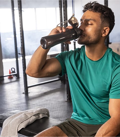 Man drinking his supplemented drink