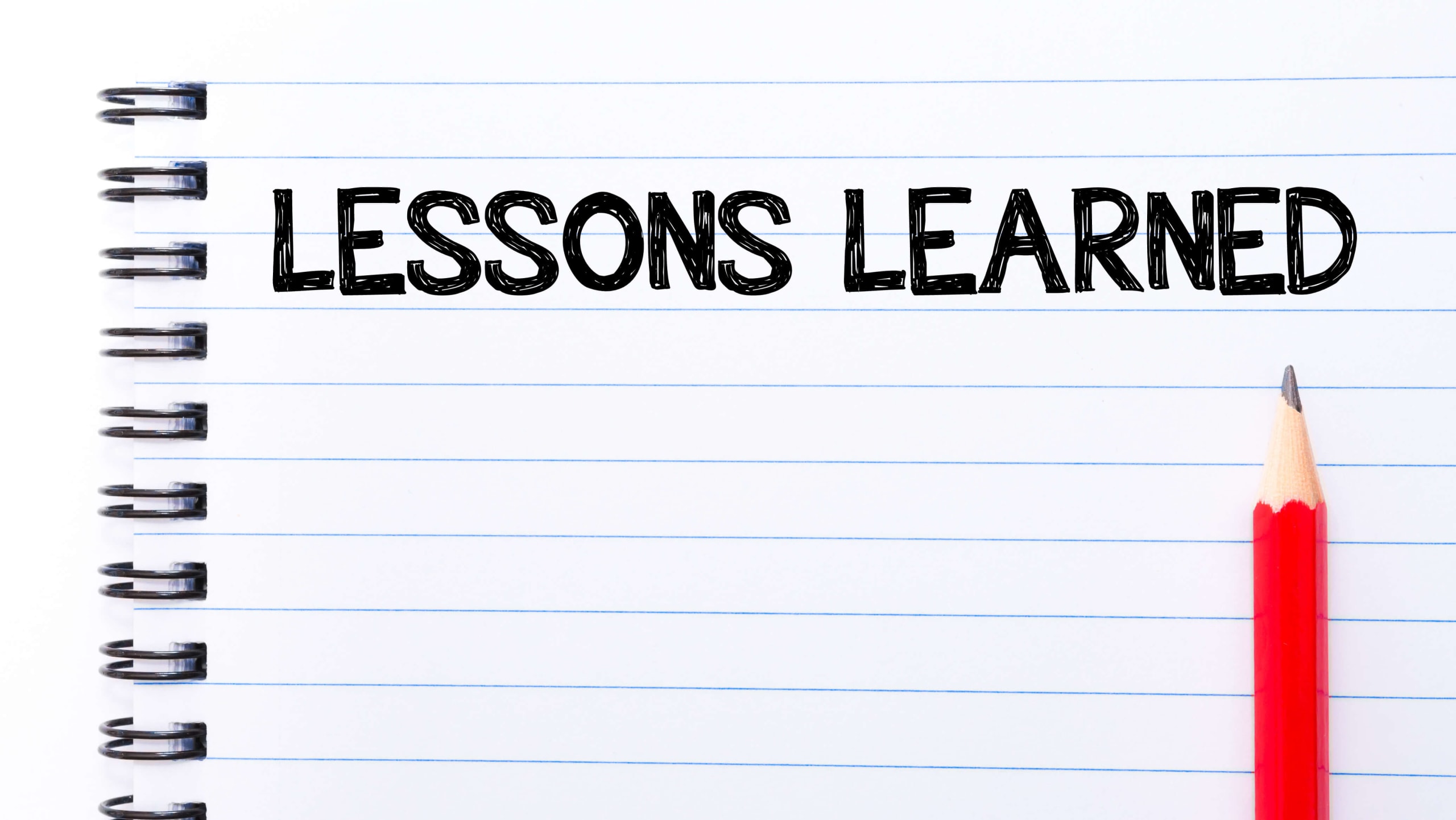 Notebook page with the words "lessons learned" on it.