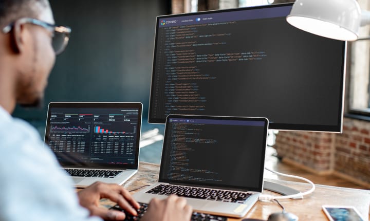 Man sitting at computer looking at Coveo interface