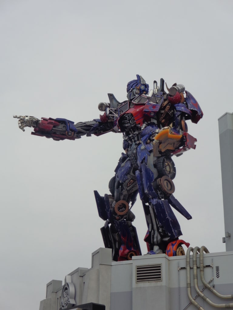 An image depicts a statue of the transformer Optimus Prime.